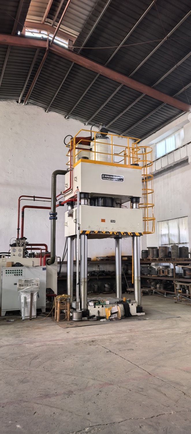 Hydraulic forming press in the metalworking workshop